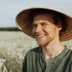 Man in Green Button Up Shirt Wearing Brown Straw Hat